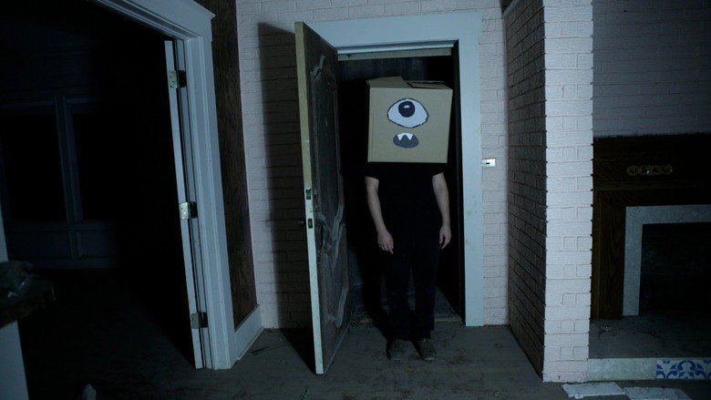 A Ghost and the Boy with a Box on His Head still 1